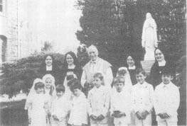 Sisters and Archbishop Lefebvre with First Communicants
