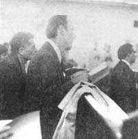 The congregation watches attentively