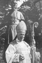 Archbishop Lefebvre before the statue of St. Pius X