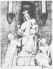statue of St. Louis de Montfort praying before  the Queen of All Hearts