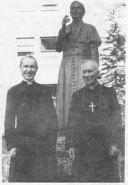 Archbishop Lefebvre and Fr Schmidberger before the statue of St Pius X