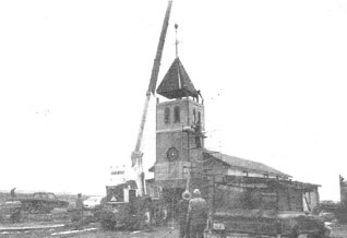 crane lifting church tower