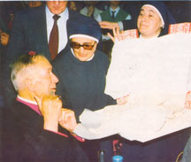 Sisters present the rochet of St. Pius X to Archbishop Lefebvre