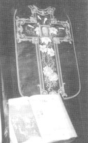 Chasuble painted by St. Therese, with the Holy Face of Jesus, roses, and lilies inside a cross
