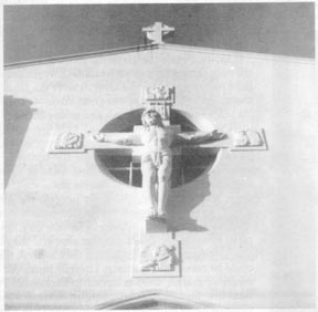 Crucifix on the front facade of the church