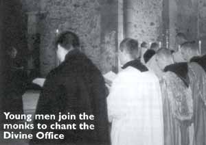 Young men join the monks to chant the Divine Office