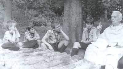 Fr Chivre teaching boy scouts